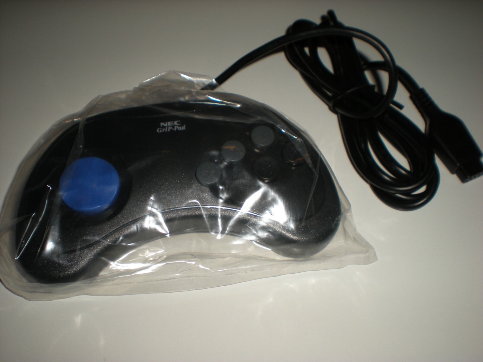 Vintage NEC Gravis GrIP-Pad retro gamepad controller. New (old stock).  Rare.