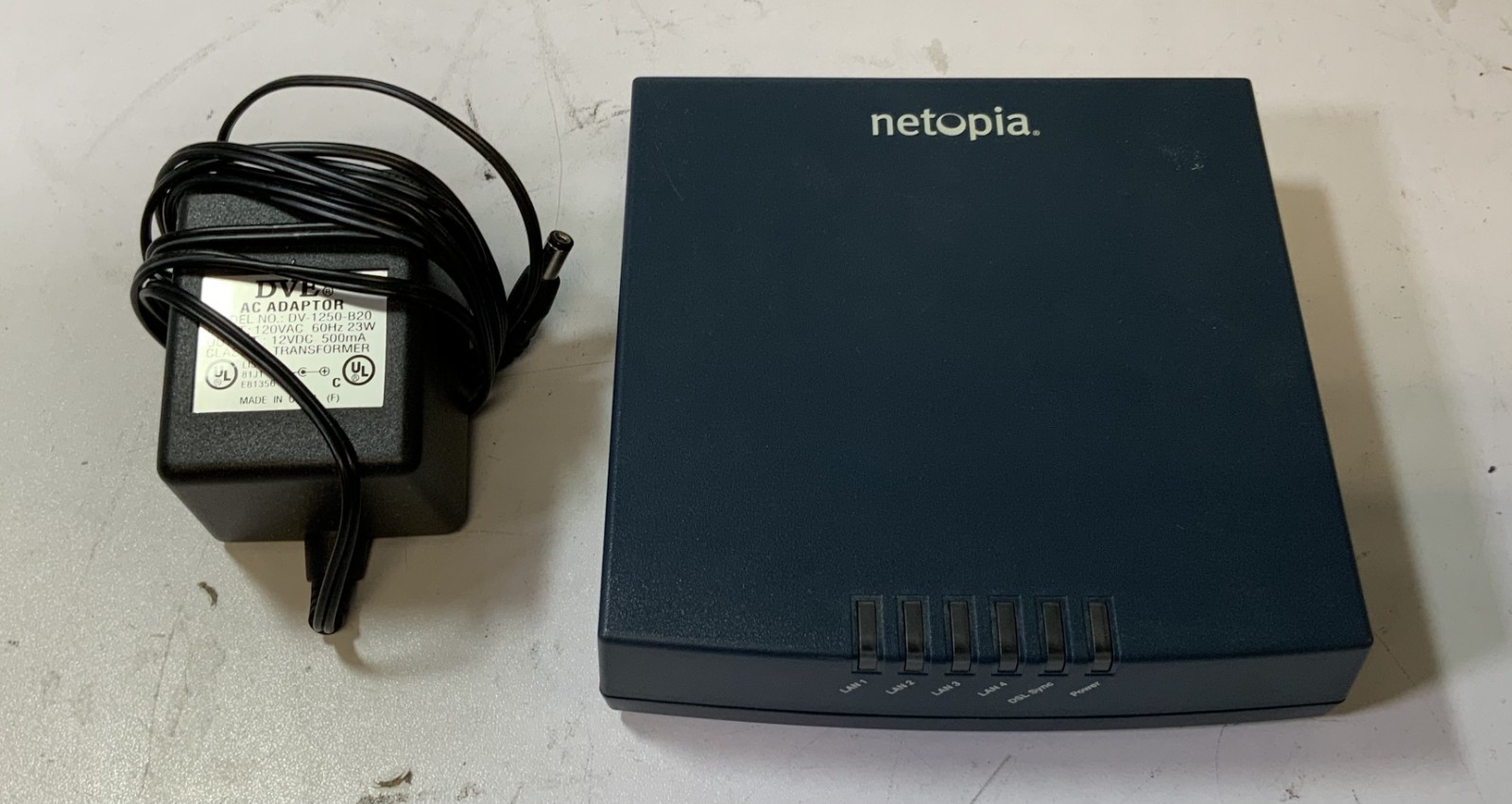 Netopia 3346N-002 23W 120V 4-Port Modem Router with Power Adapter, Black "E4F"