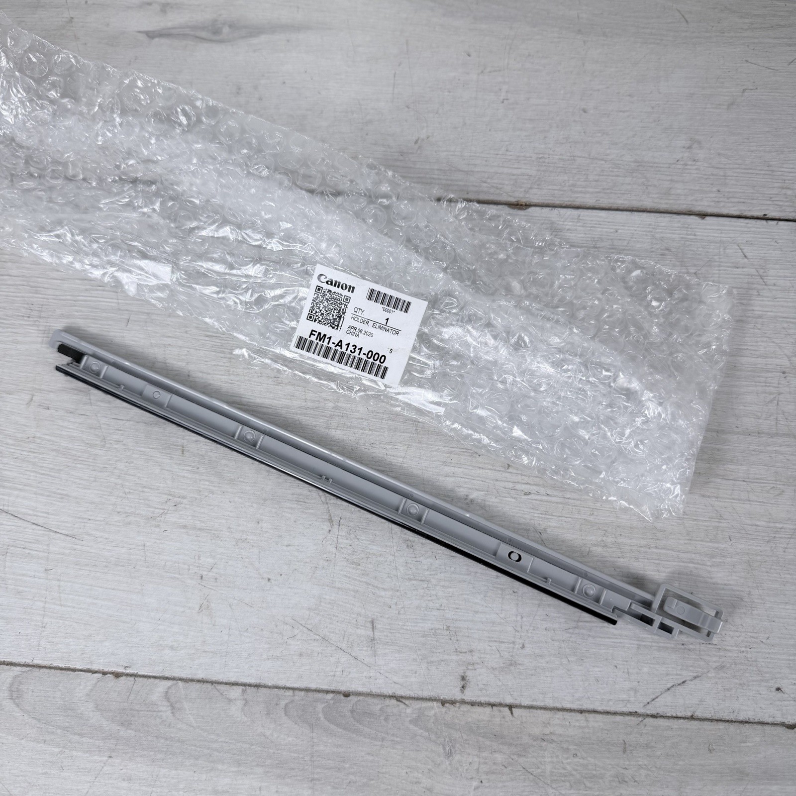 Canon FM1-A131-000 HOLDER ELIMINATOR OEM