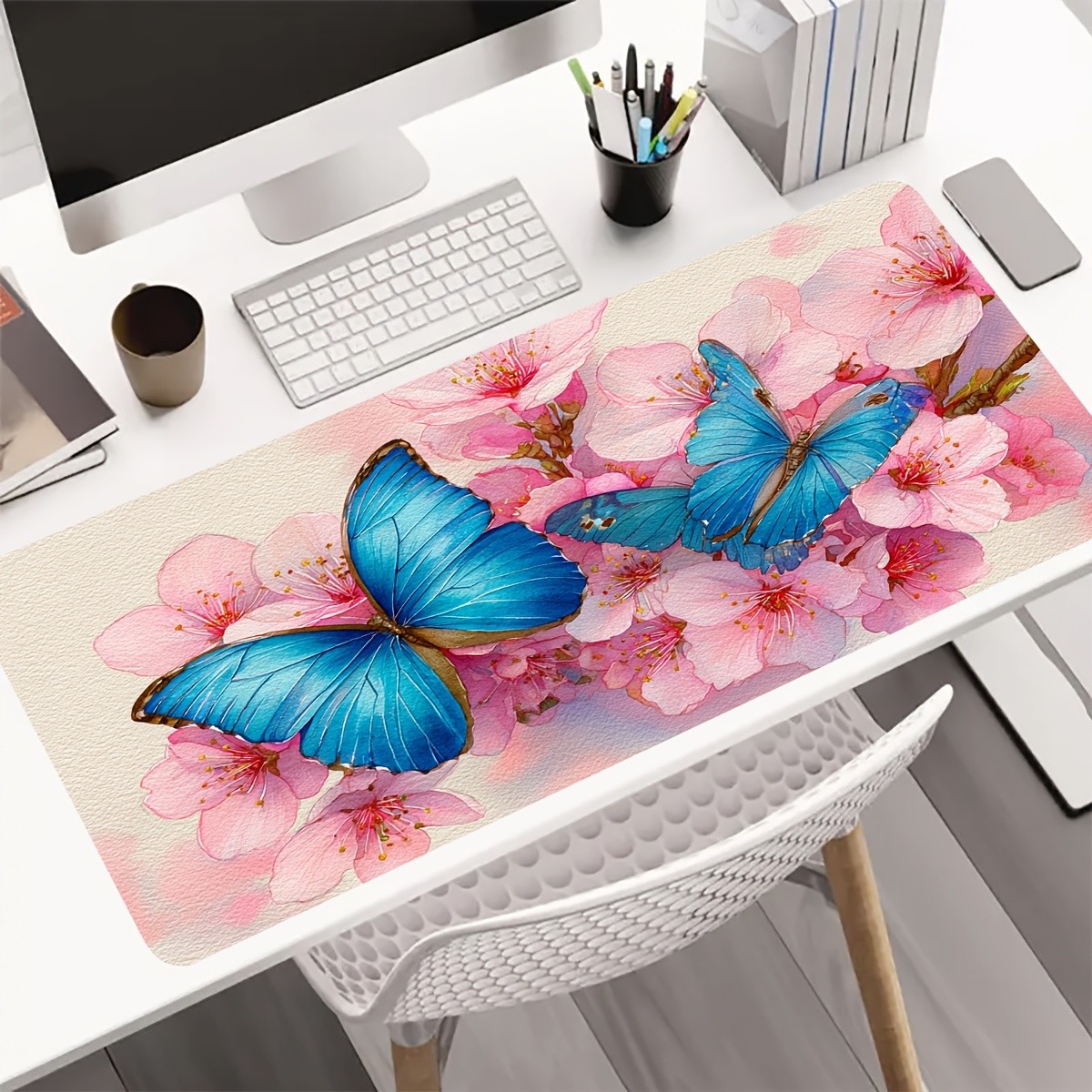 A Large Gaming Mouse Pad Featuring a Watercolor-Style Blue Butterfly Resting o
