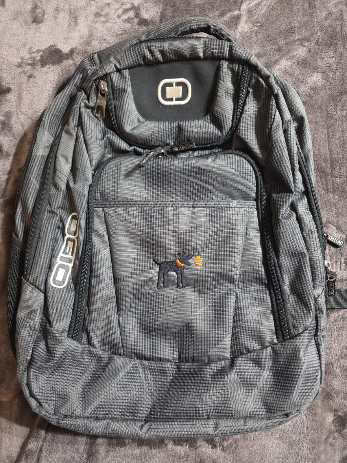 OGIO 411069 Excelsior 17" Laptop  Backpack 18×16 8 Pocket Dog Logo 2 Bottle Side