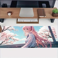 A Large Rubber Mouse Pad Featuring a Pink Cherry Blossom Design, Perfect for D picture