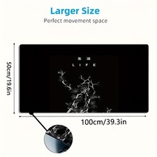 A Large Gaming Mouse Pad Featuring a Minimalist Black And White Floral Design, picture